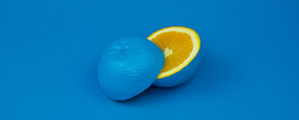 Photo by davisco on Unsplash - Lemon painted blue on the outside sliced to reveal bright yellow within