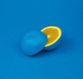 Photo by davisco on Unsplash - Lemon painted blue on the outside sliced to reveal bright yellow within