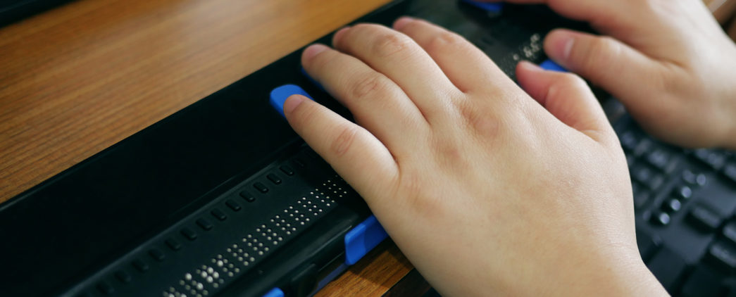 Close-up of a braille display in use.