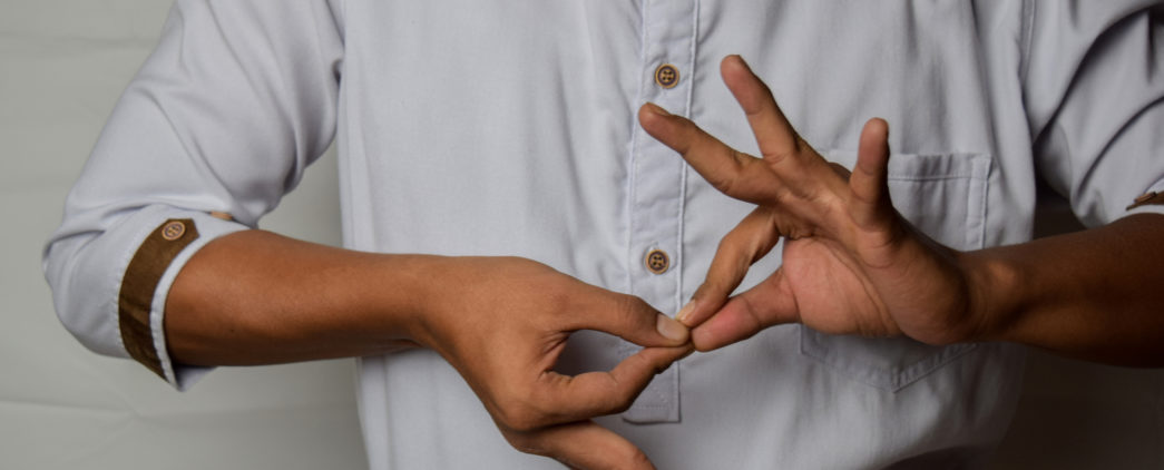 Man signing interpreter in American Sign Language