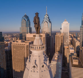 Statue of William Penn seen with the Philadelphia skyline.