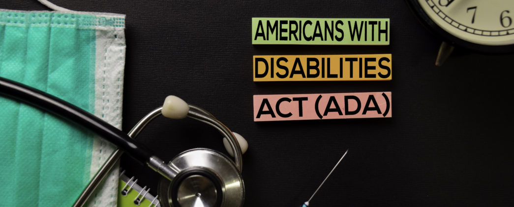 Americans with Disabilites Act (ADA) text on top view black table with blood sample and Healthcare/medical concept.