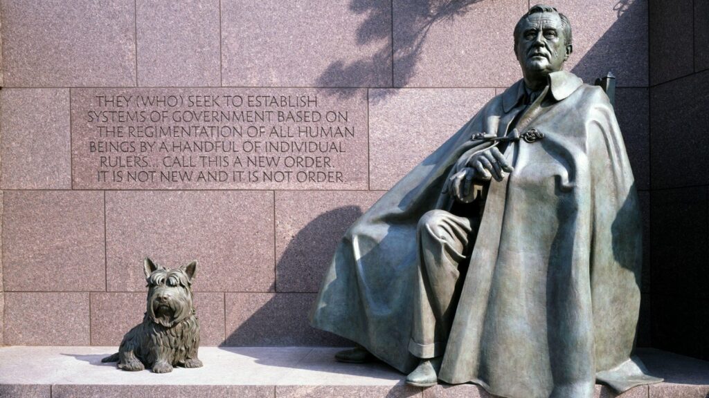 A statue of Franklin Delano Roosevelt seated with his dog at his side. The quote beside him reads, “They who seek to establish systems of government based on the regimentation of all human beings by a handful of individual rulers call this a new order. It is not new and it is not order.”